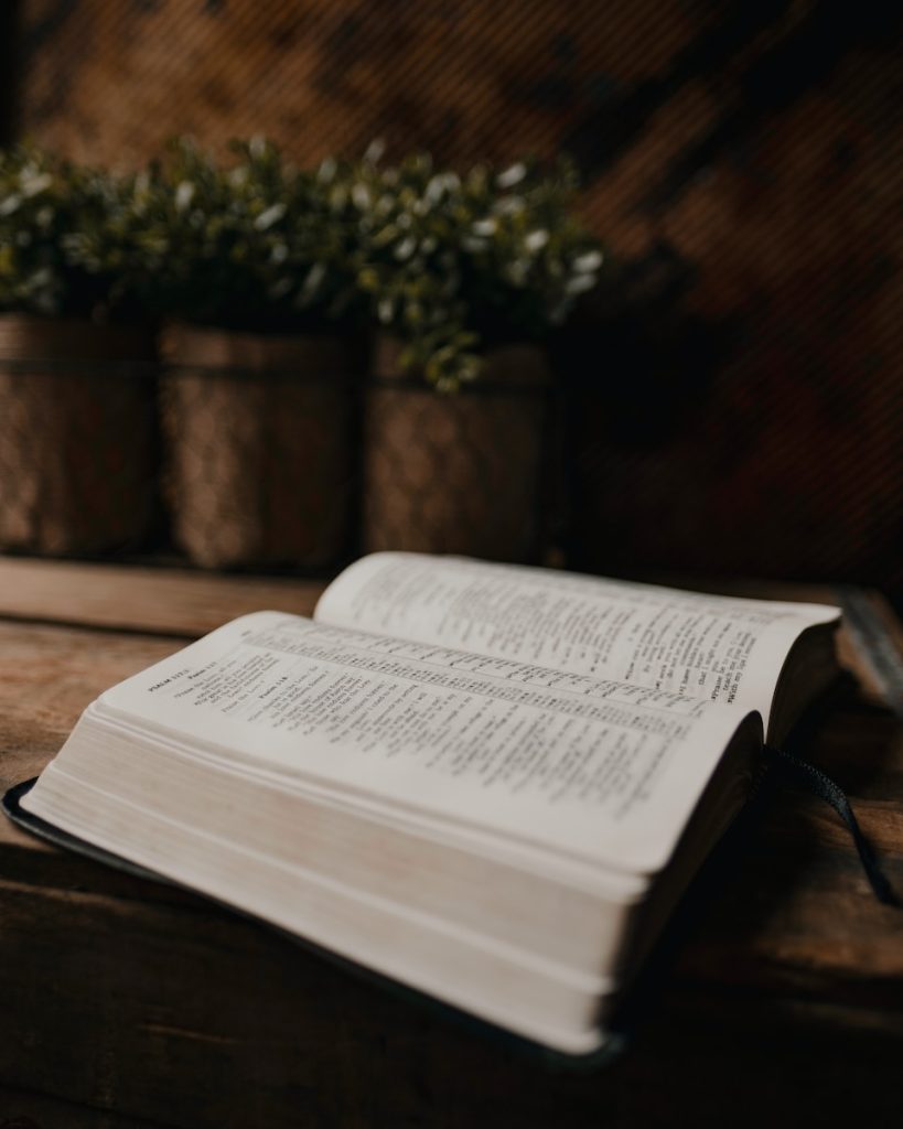 white book page on brown wooden table